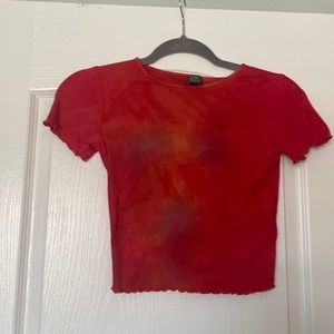 Red tie dye with purple, orange, and yellow spots